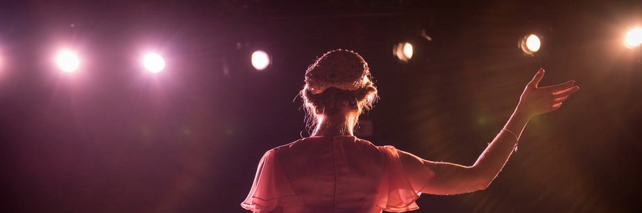 performer-on-stage-in-theater-lights-it-could-have-been-your-own-theatre-an-home-theater-collection-image
